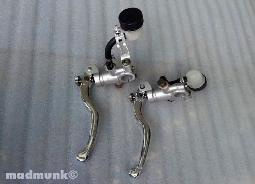 PAIR OF LEVERS BRAKE AND CLUTCH WITH CLEAR OIL POTS SILVER